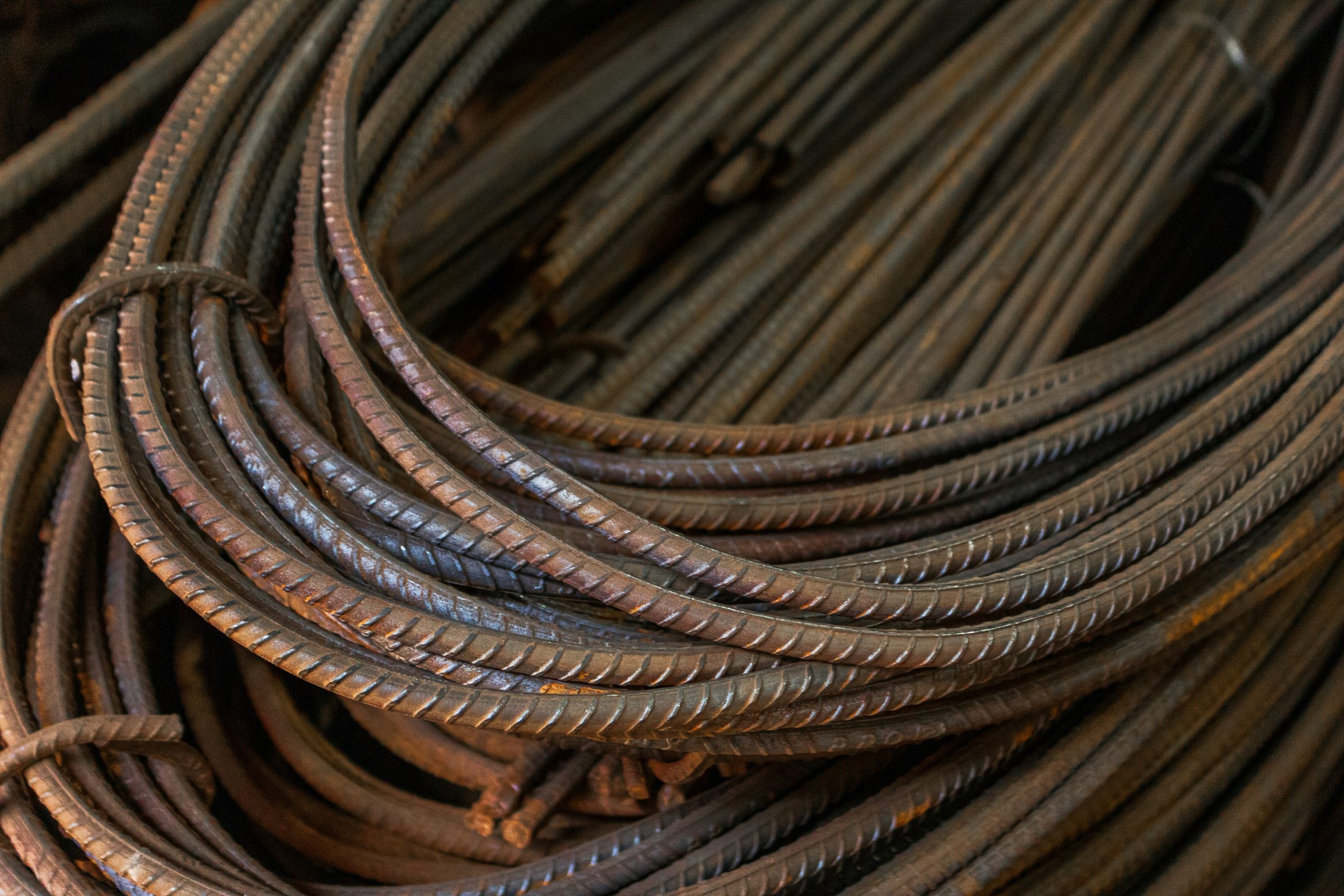 Coiled lengths of steel reinforcing bar.