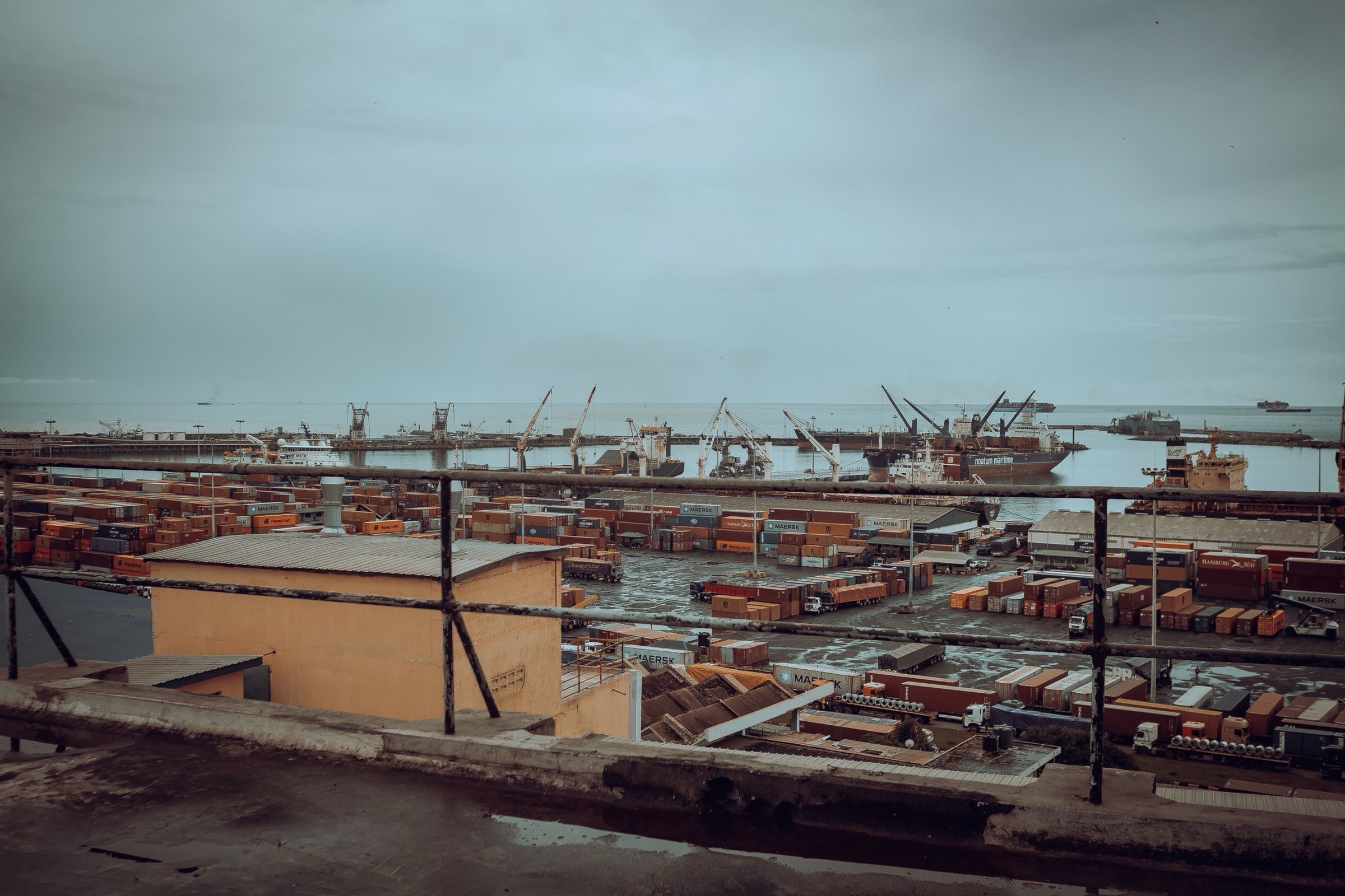 A container yard and ships alongside at a West African port.